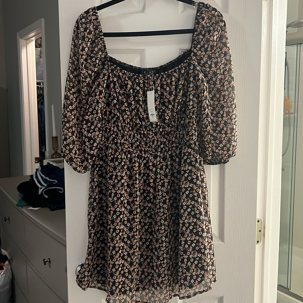 Francesca’s dress with peplum detailing floral